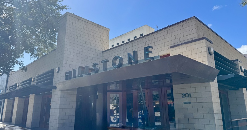 Modern brick storefront of Hillstone on Miracle Mile in Coral Gables, Florida