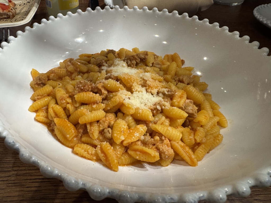 Sardinian malloreddus pasta with Mutti tomato, sausage ragù, saffron, and pecorino romano cheese at Il Pastaio di Eataly in Aventura Mall, Florida