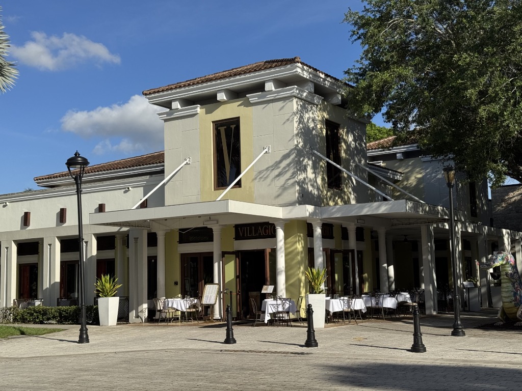 Elegant stucco exterior and outdoor patio seating at Villagio in Sawgrass Mills Sunrise, Florida